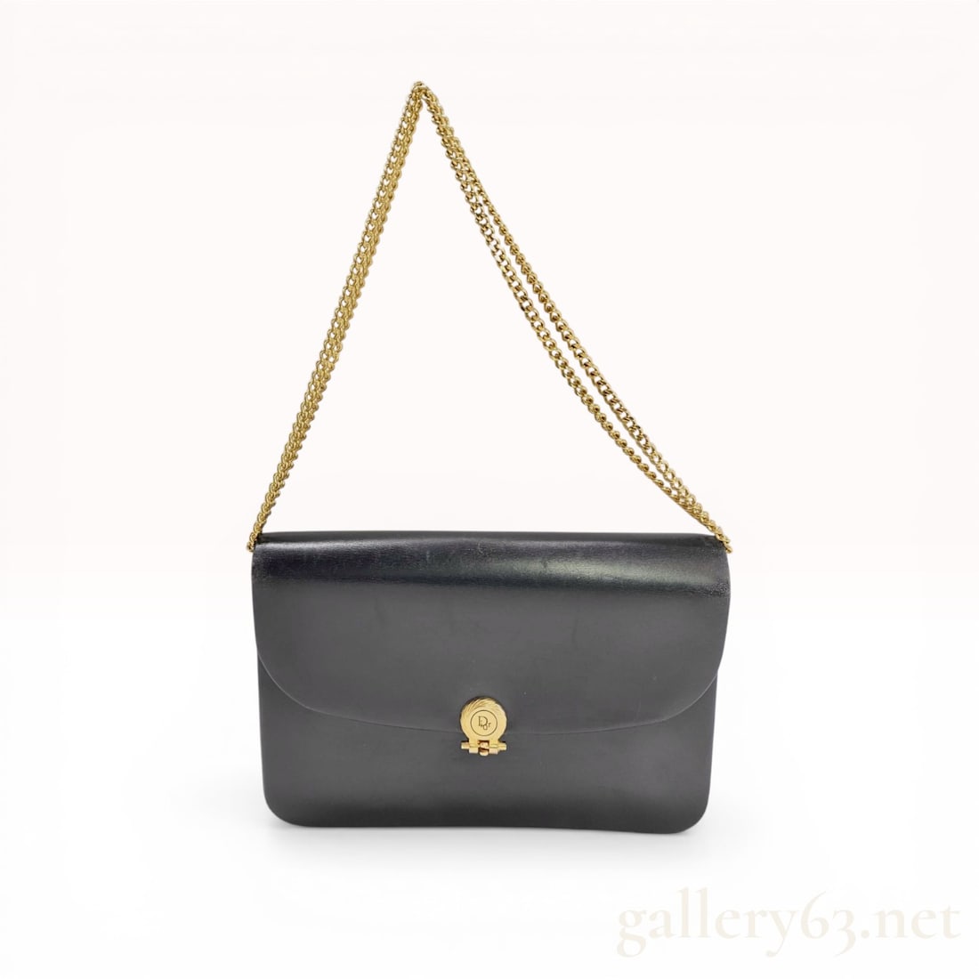 Christian Dior Vintage Black Leather Chain Flap Shoulder Bag: Christian Dior vintage flap shoulder bag, mid-to-late 20th century. The bag is constructed from smooth black leather and features a double gold-tone curb link chain strap and a front flap with a mecha