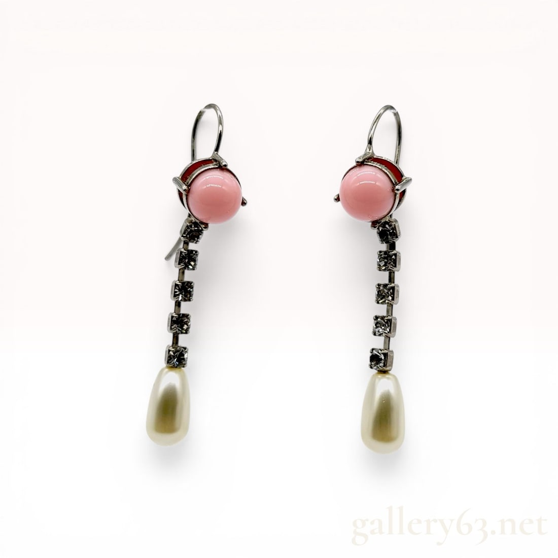 A Pair of Miu Miu Silver-Tone Pink Cabochon and Faux Pearl Drop Earrings: A matched pair of Miu Miu drop earrings featuring a silver-tone metal construction with French wire hook backings. Each earring is designed with a round pink cabochon in a multi-prong setting above a