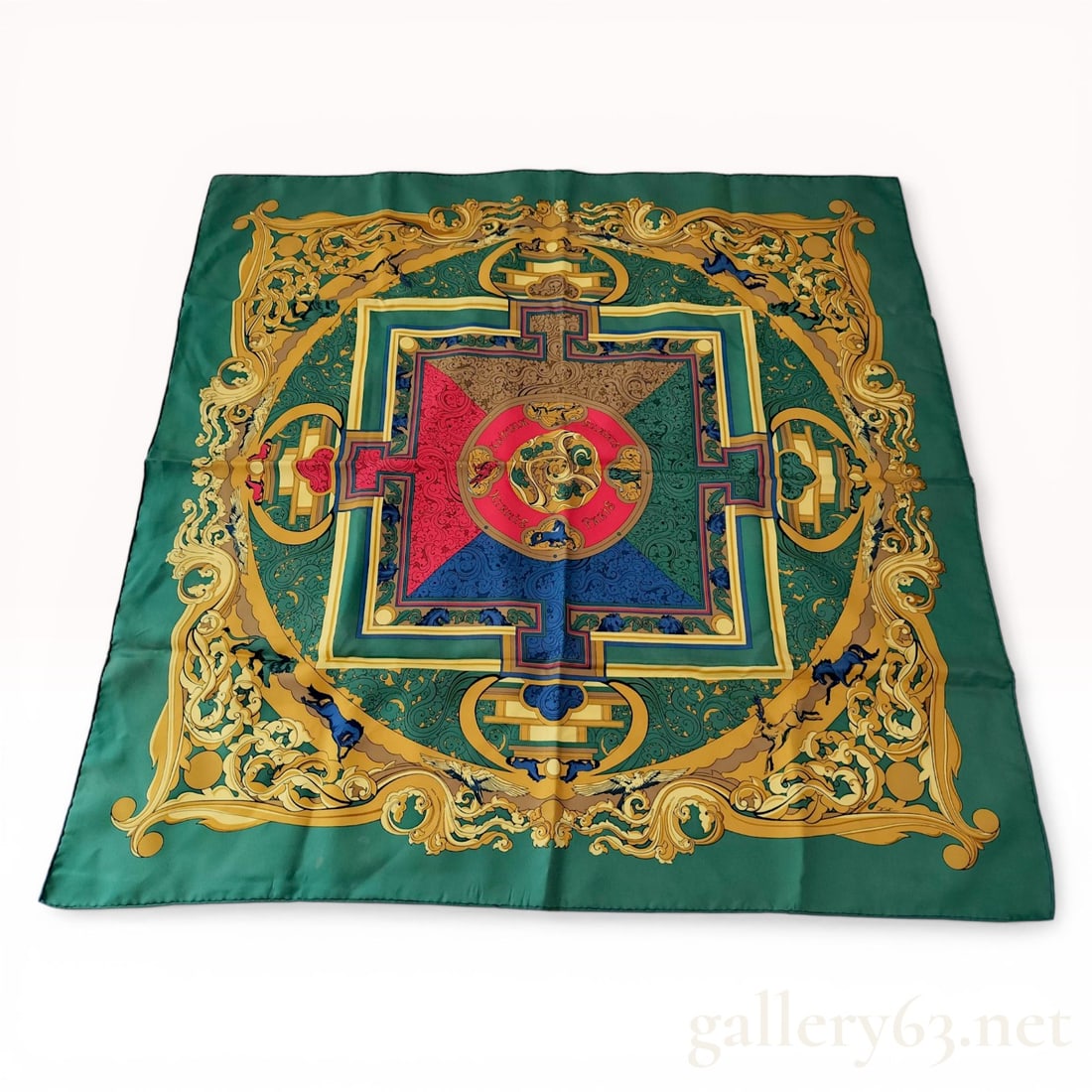 Herm?¨s Animaux Solaires Silk Twill Scarf by Zoe Pauwels: Hermès silk twill scarf in the Animaux Solaires pattern, designed by Zoe Pauwels, late 20th century. The design features a central mandala with celestial animal motifs surrounded by ornate gold