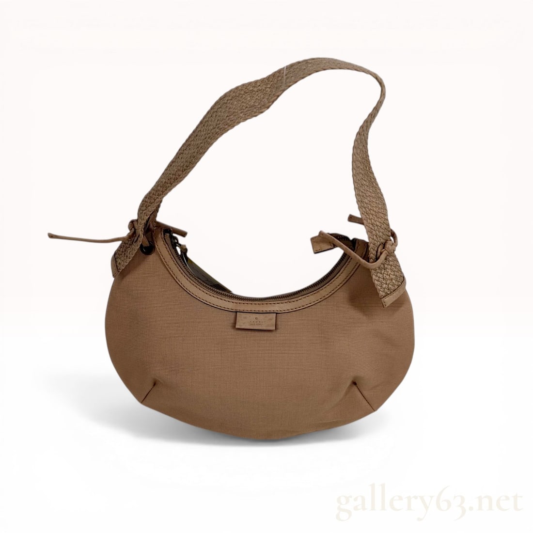 Gucci Tan Canvas Crescent Hobo Bag with Braided Strap: Gucci crescent-shaped hobo shoulder bag featuring a tan canvas body and tonal leather trim. The design includes a wide, braided leather shoulder strap attached via knotted leather cords through brass-