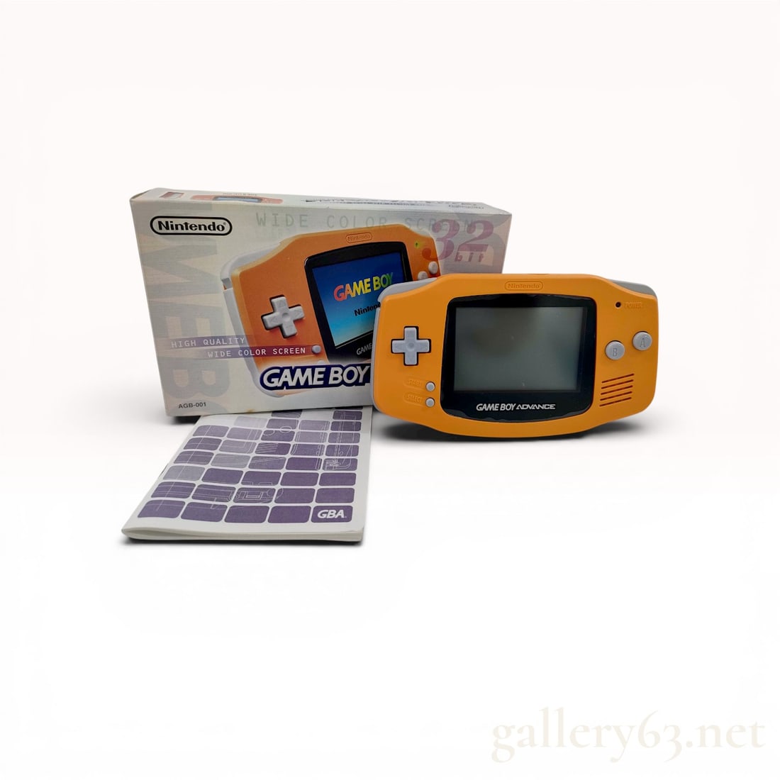 Nintendo Game Boy Advance Spice Orange Handheld Console in Original Box: Nintendo Game Boy Advance handheld video game console, model AGB-001, circa 2000. The unit features a molded plastic housing in Spice Orange with gray buttons and a horizontal form factor. This lot in