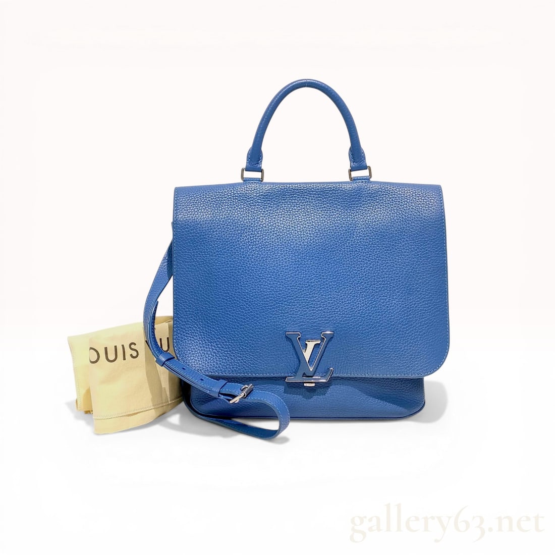 Louis Vuitton Blue Taurillon Leather Volta Bag: Louis Vuitton Volta handbag crafted from blue grained Taurillon leather with silver-tone hardware and a signature LV twist-lock. The interior features a microfiber lining, a zippered pocket, and a lea