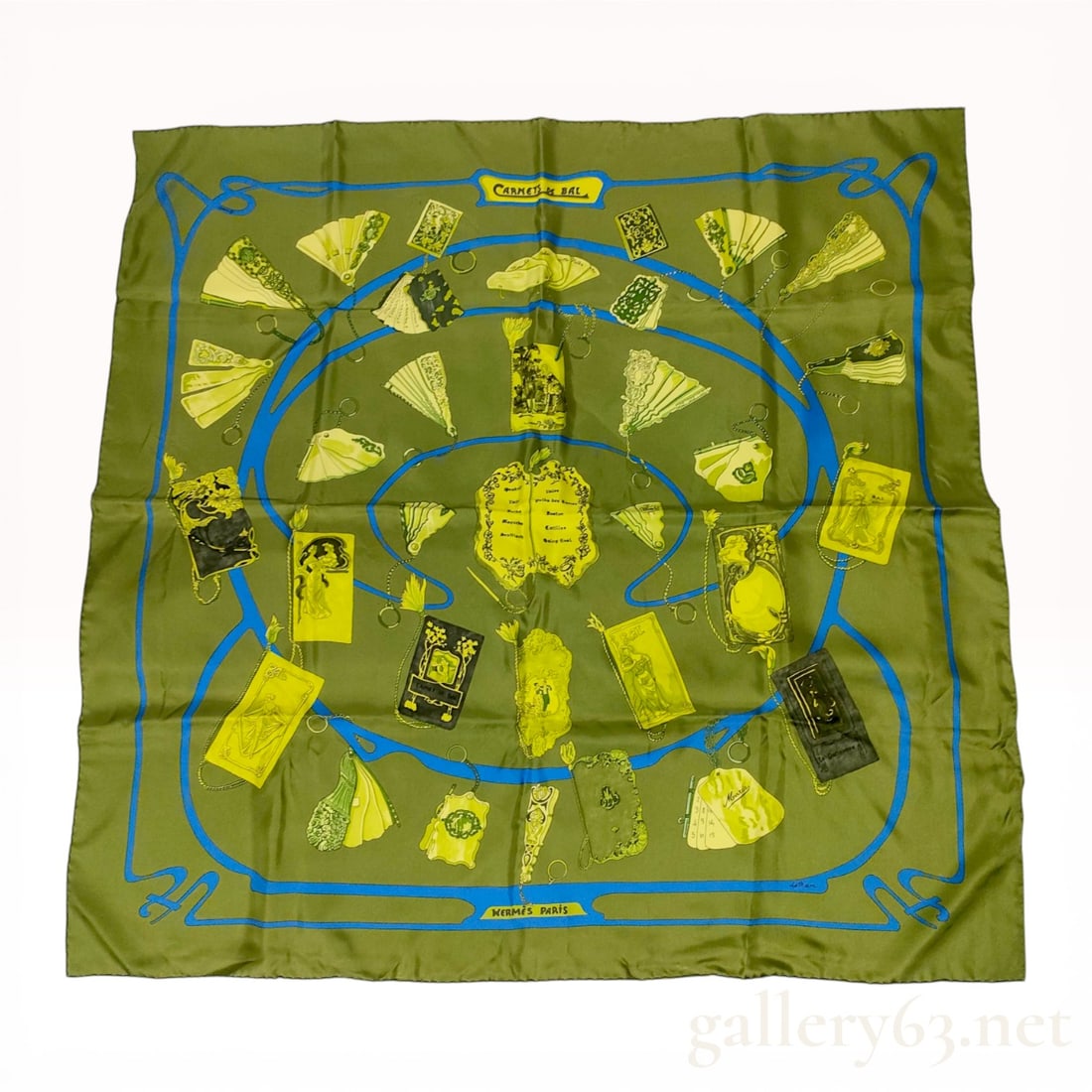 Hermes Carnets de Bal Silk Scarf by Caty Latham: Hermes silk twill scarf in the Carnets de Bal pattern, designed by Caty Latham and originally issued in 1954. The olive green ground features 19th-century dance cards and fans in shades of yellow and