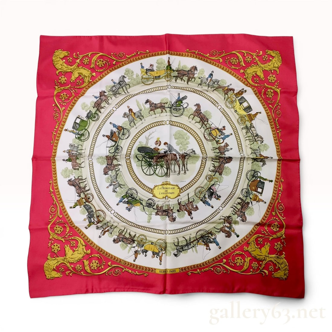 Hermes La Promenade de Longchamps Silk Scarf: Hermes silk twill scarf in the La Promenade de Longchamps pattern, originally designed by Philippe Ledoux in 1965. The design features concentric circles of nineteenth-century horse-drawn carriages an