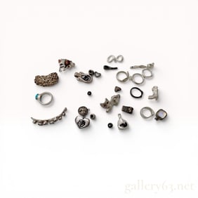 An Assortment of Silver-Toned Artisan and Novelty Costume Jewelry