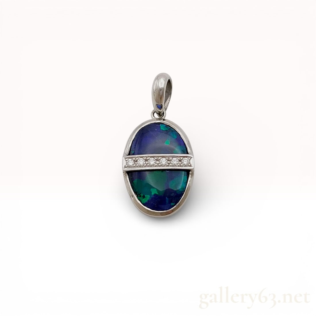 Platinum, Australian Black Opal, and Diamond Pendant: Modern platinum pendant featuring a central oval cabochon opal and accent diamonds. The opal exhibits a dark body tone with vibrant blue and green play of color, bisected by a horizontal bar channel-s