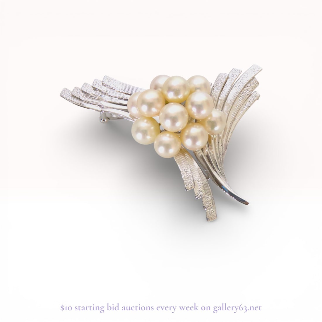 Japanese Mid-Century Cultured Pearl and Silver Spray Brooch: Japanese mid-century modern spray brooch featuring a central cluster of eleven cultured pearls. The silver metal rays exhibit alternating textured and polished finishes, fanning out from a central rai