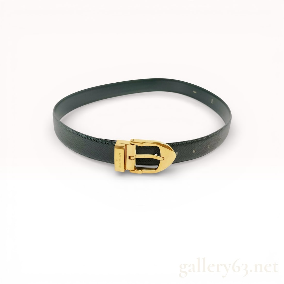 Louis Vuitton Green Taiga Classique Belt: Louis Vuitton Green Taiga Classique belt, produced in May 1993. This accessory is constructed from dark forest green Taiga leather with a characteristic cross-hatched texture and features a gold-tone