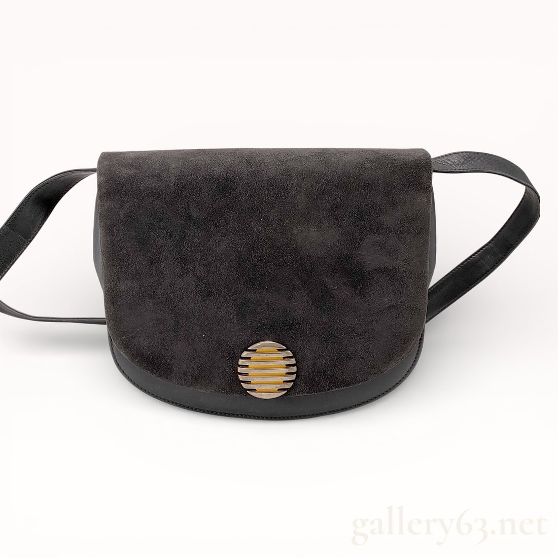 Bally Suede and Leather Saddle-Style Flap Bag: Bally Swiss-made shoulder bag featuring a charcoal gray suede flap over a smooth black leather body. The interior utilizes an accordion-style design with three compartments and a rear zippered pocket,