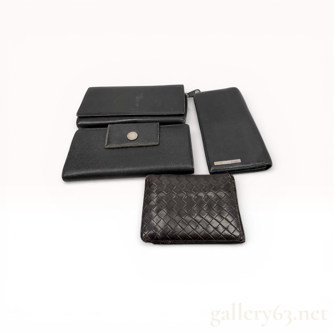 A Collection of Four Designer Leather Wallets Including Bvlgari, Cartier, and Coach (1 of 10)