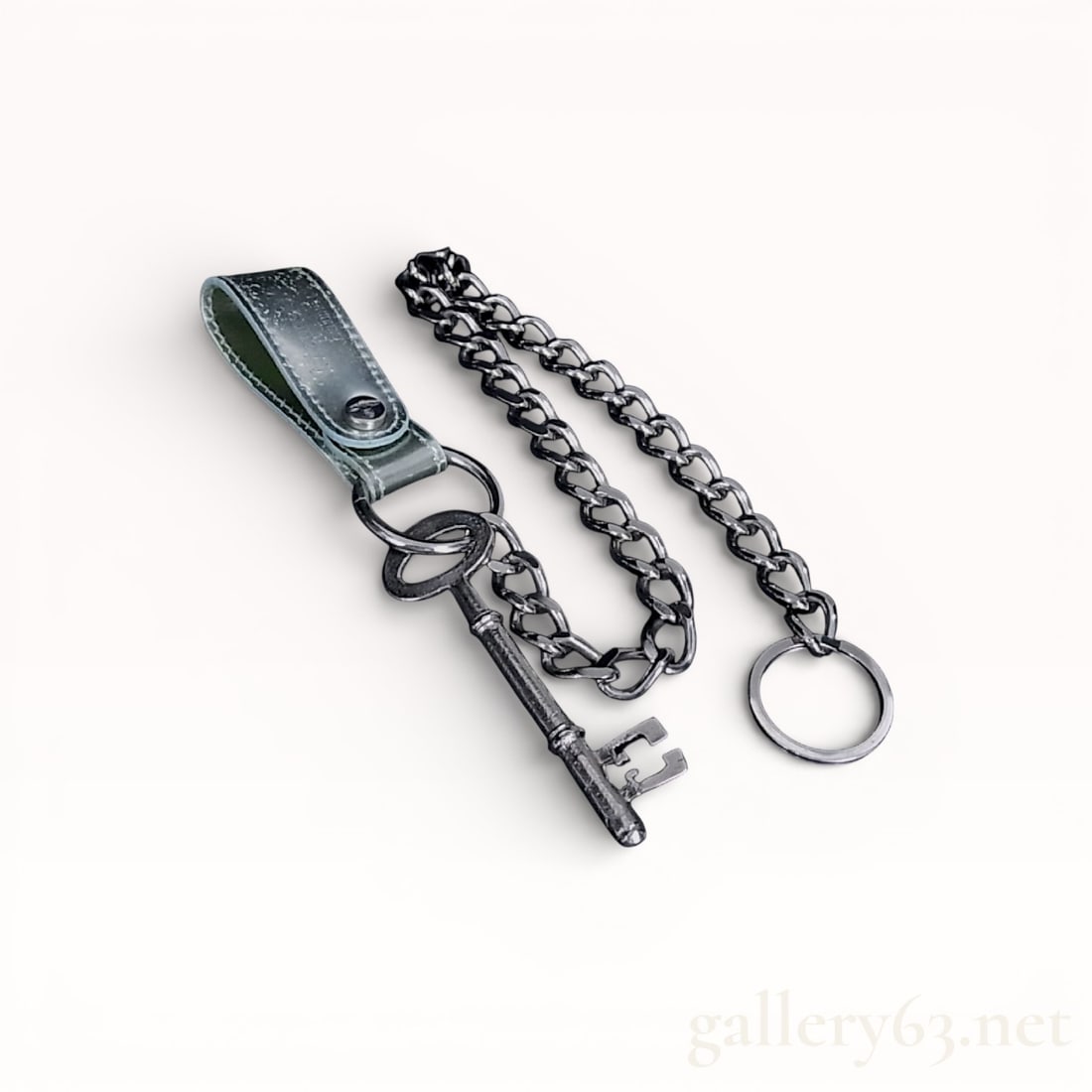 Vivienne Westwood Silver-Tone Leather and Metal Skeleton Key Belt Chain: Vivienne Westwood designer belt accessory featuring a decorative skeleton key and heavy curb link chain. The assembly includes a silver-toned genuine leather belt loop with a snap fastener and multipl