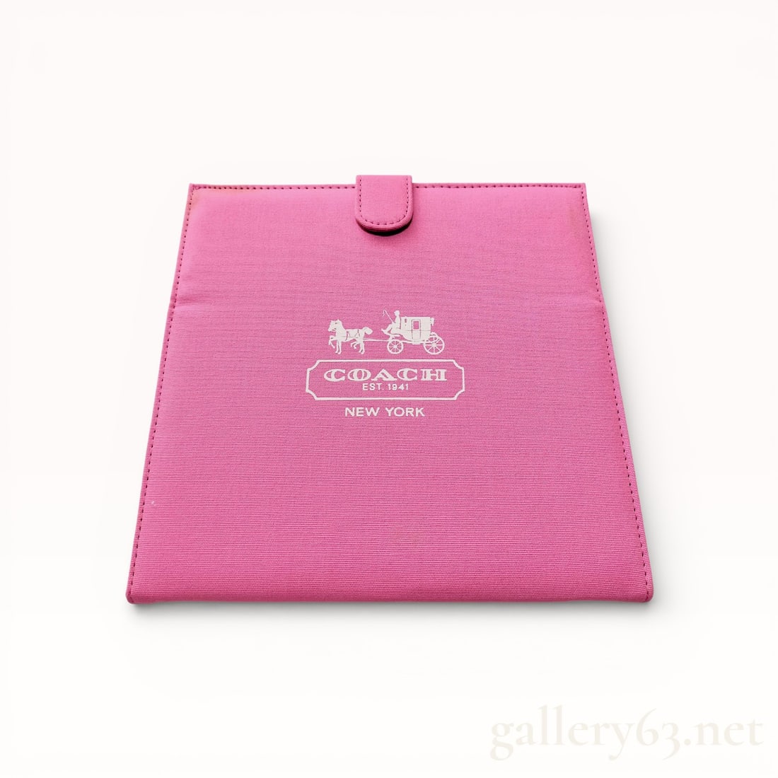 Coach Pink Canvas Folding Travel Vanity Mirror: Coach folding travel vanity mirror featuring a pink canvas exterior and a glass interior. The front displays the white printed horse and carriage logo with COACH EST. 1941 NEW YORK, while the reverse