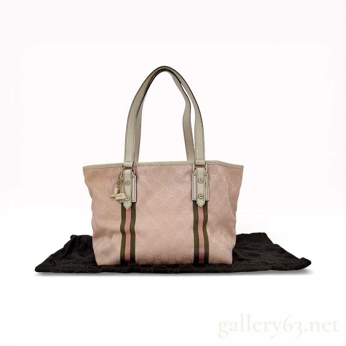 Gucci Pink GG Monogram Canvas Jolicoeur Tote Bag: Gucci Jolicoeur tote bag featuring pink GG monogram canvas and off-white textured leather trim. The exterior is accented with green and pink striped webbing, gold-tone hardware, and a signature boot a