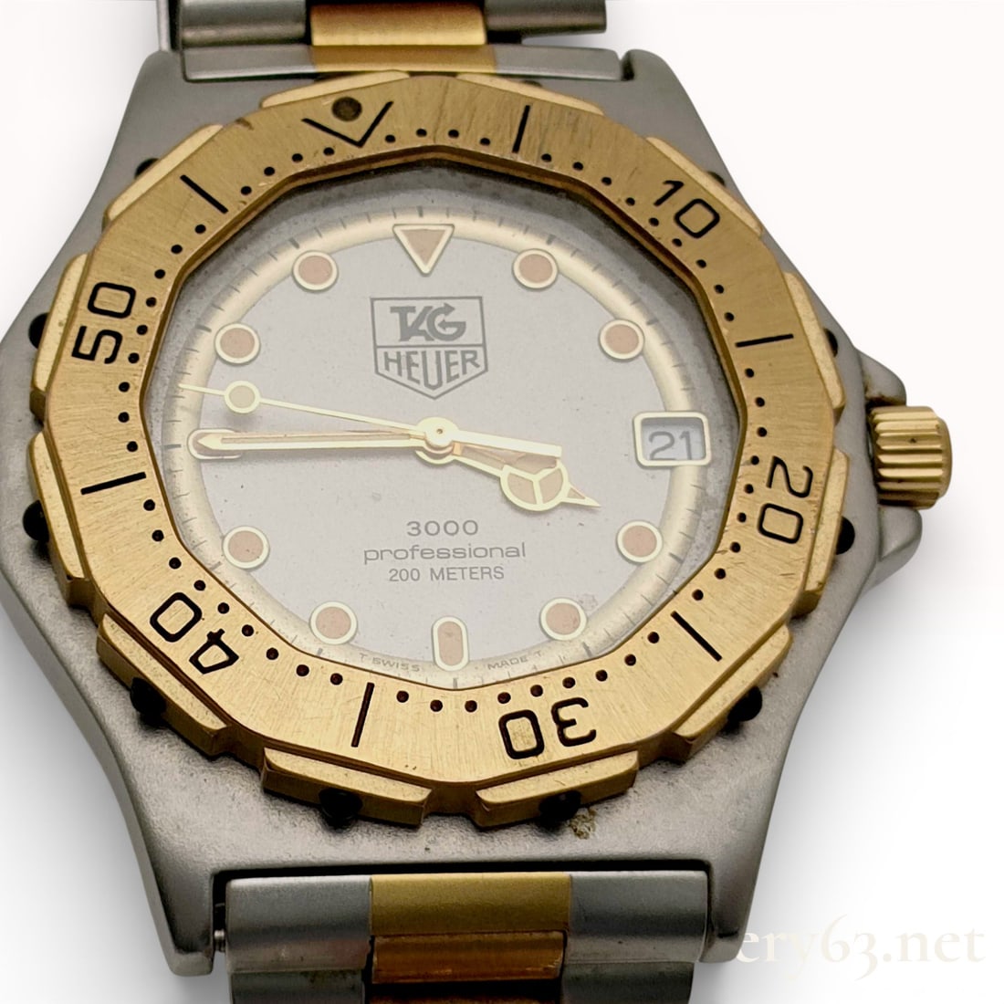 TAG Heuer 3000 Professional 200 Meters Quartz Watch Reference 934.206: TAG Heuer 3000 Professional 200 Meters quartz wristwatch, reference 934.206. The timepiece features a two-tone stainless steel case with a matte gray finish, a gold-tone unidirectional rotating bezel,