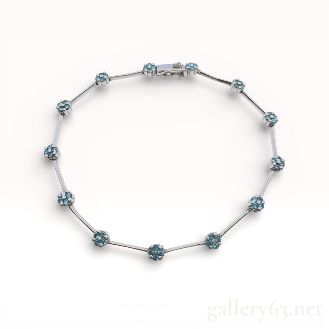 Platinum and 1.134ctw Diamond Floral Cluster Link Bracelet: Platinum link bracelet featuring eleven floral clusters joined by articulated polished bar sections. Each cluster is set with round-cut diamonds, totaling fifty-five stones across the piece. The brace