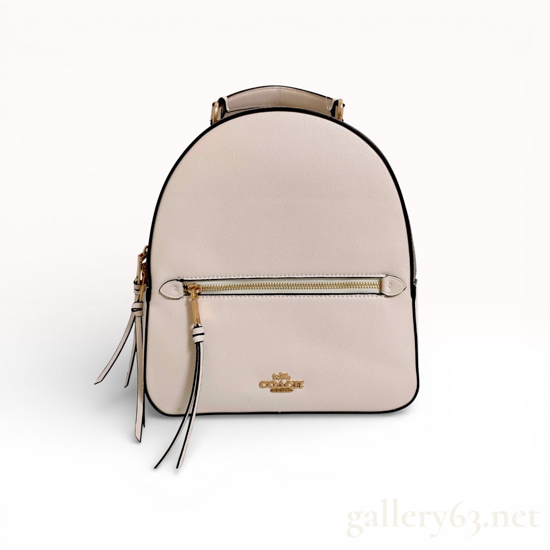 Coach Jordyn Backpack in Signature Canvas and Chalk Leather: Coach Jordyn backpack featuring a combination of chalk-colored crossgrain leather and brown signature monogram coated canvas. The design includes a front zippered pocket with elongated leather tassel