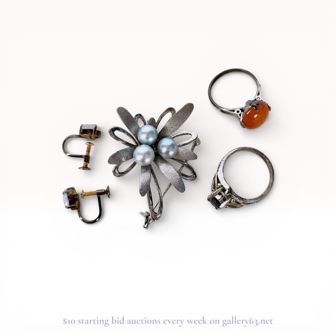 An Assortment of Vintage Jewelry Including a Sterling Silver Brooch, Opal Earrings, and Rings (1 of 6)