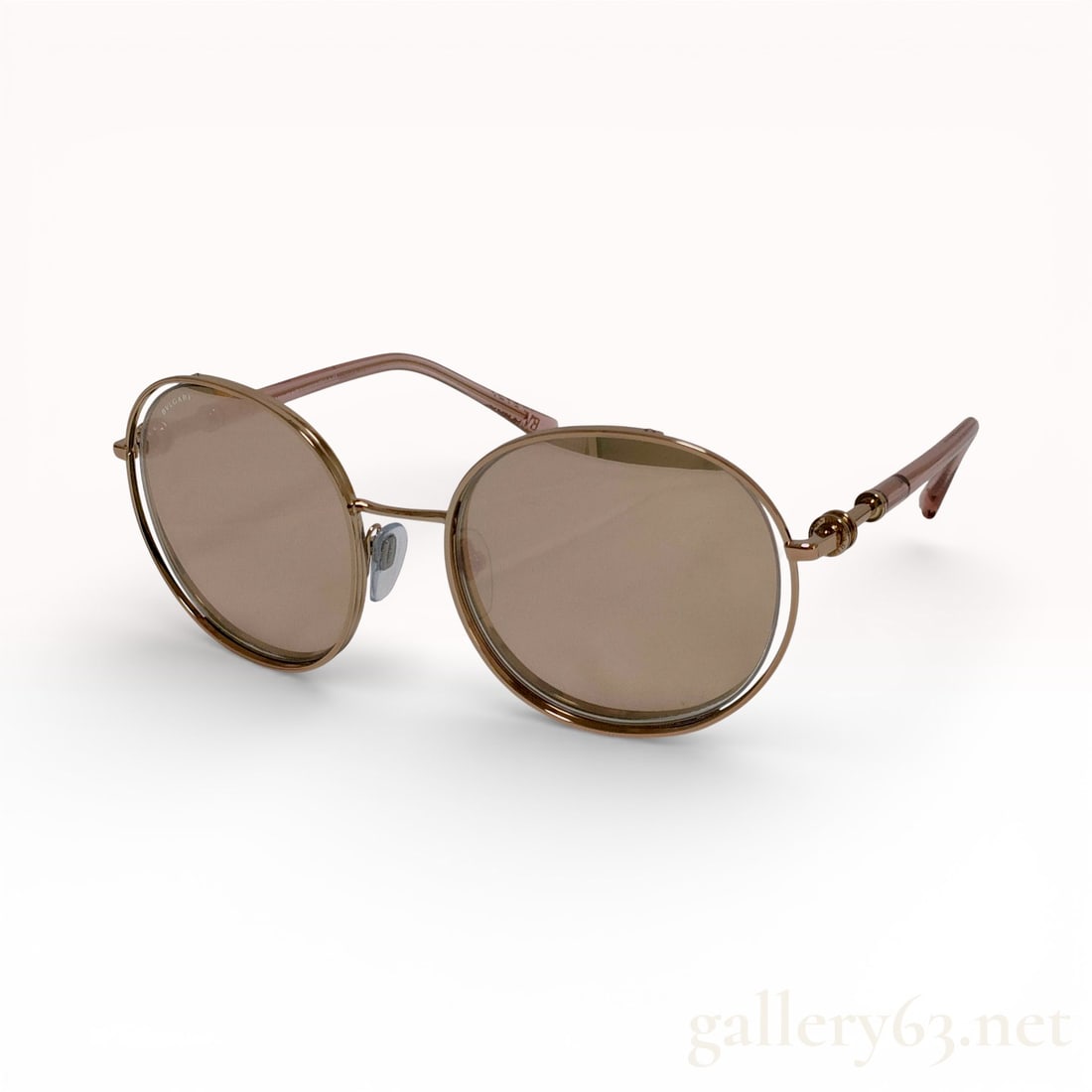 Bvlgari BV6169 Round Floating Lens Sunglasses: Bvlgari round sunglasses, model BV6169, featuring a floating lens design. Constructed with gold-tone metal frames, brown tinted lenses, and translucent pinkish-taupe acetate temple tips. The temples i