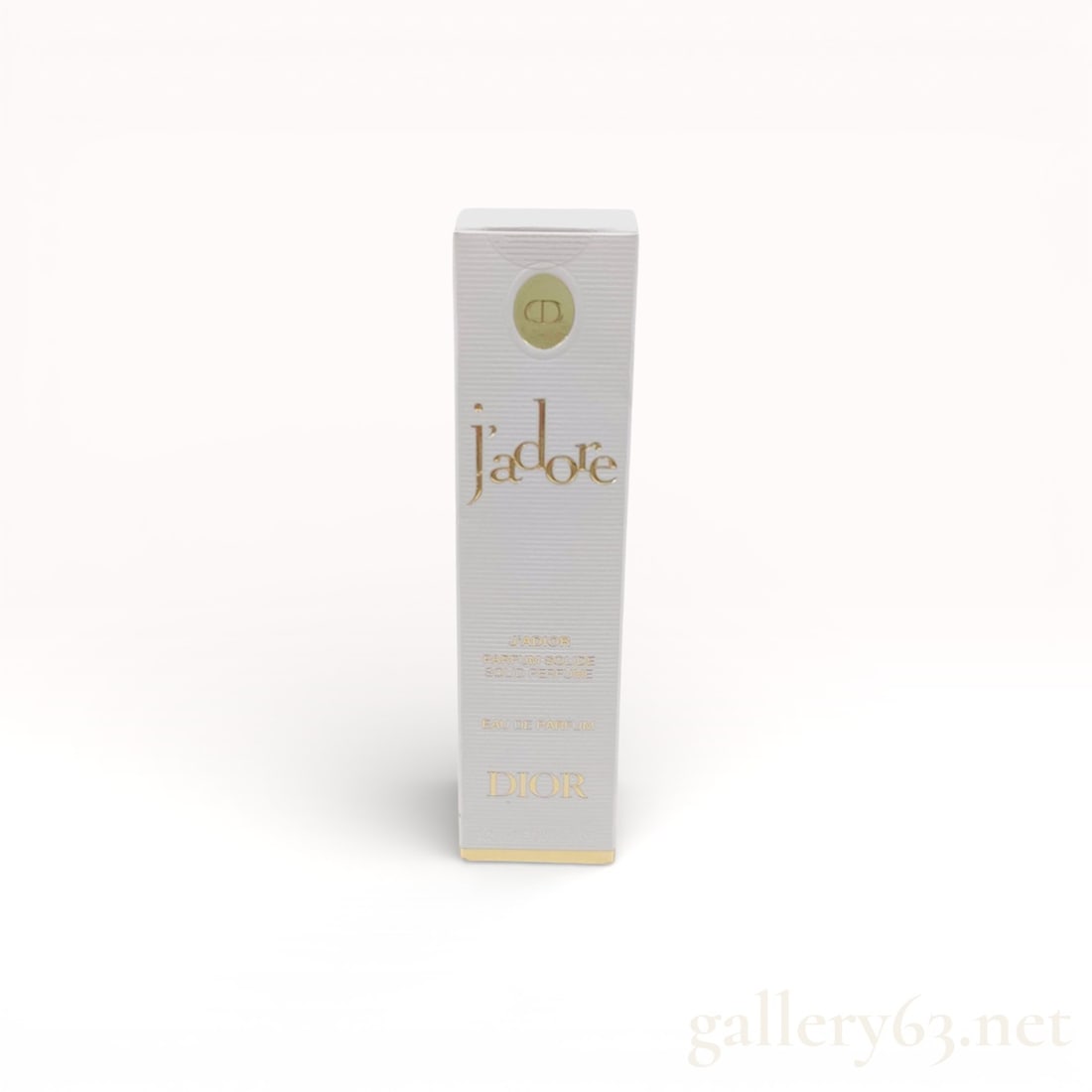 Dior J'adore J'adior Parfum Solide Solid Perfume Stick: Christian Dior J'adore J'adior Parfum Solide, a modern solid perfume stick in original retail packaging. The creamy, pearlescent formula is infused with jasmine wax and presented in a textured white p