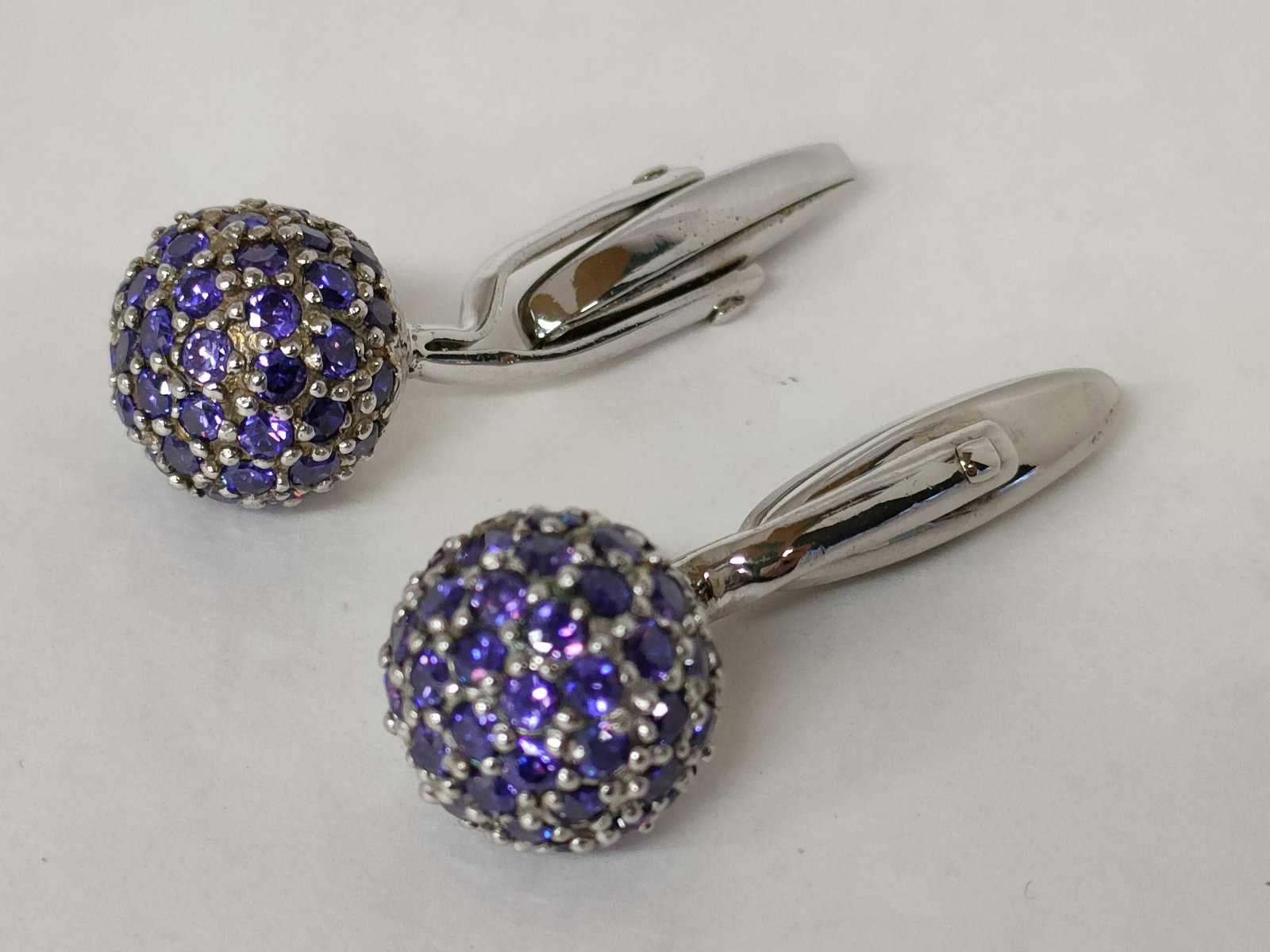 A Pair of Sterling Silver and Purple Stone Pave Orb Cufflinks (1 of 7)