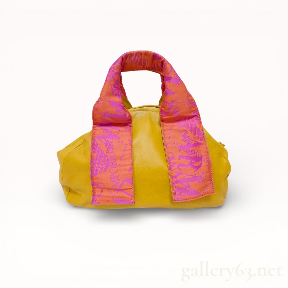 Emporio Armani Yellow Leather Satchel with Logo Fabric Handles: Emporio Armani small satchel bag featuring a smooth yellow leather body and fabric-wrapped top handles. The handles are printed with a repeating pink and orange logo motif, and the interior is lined i