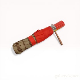 Two Coach Signature Monogram Items Including a Folding Umbrella and Matching Sleeve