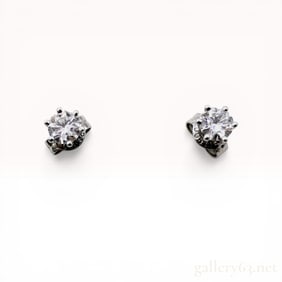 A Pair of Platinum and Diamond Solitaire Stud Earrings
