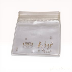 A Collection of Melee Diamonds in a L'or Branded Pouch