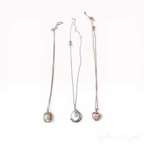 A Trio of Sterling Silver and Cultured Pearl Pendant Necklaces