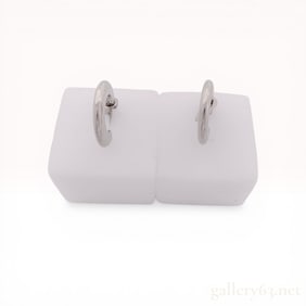 A Pair of Coach Silver-Tone C-Shaped Hoop Earrings