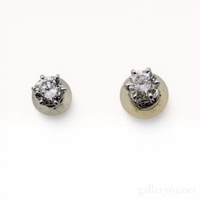 Pair of Platinum and Diamond Solitaire Stud Earrings
