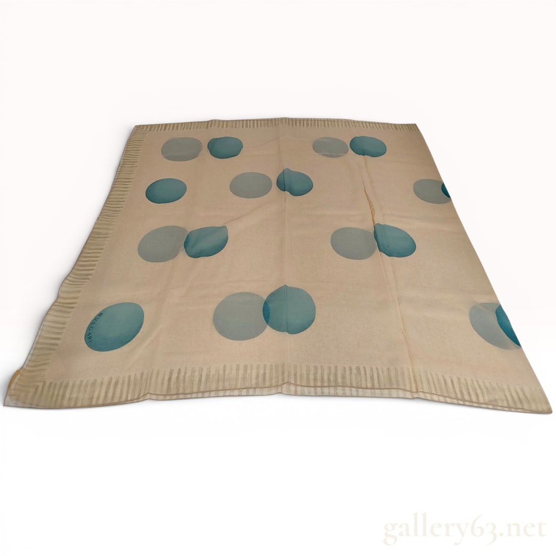 Bvlgari Italian Silk Scarf with Overlapping Circle Pattern: Bvlgari Italian silk scarf featuring an abstract pattern of large overlapping circles in shades of teal and blue on a cream-colored field. The composition is framed by a tan vertically striped border 