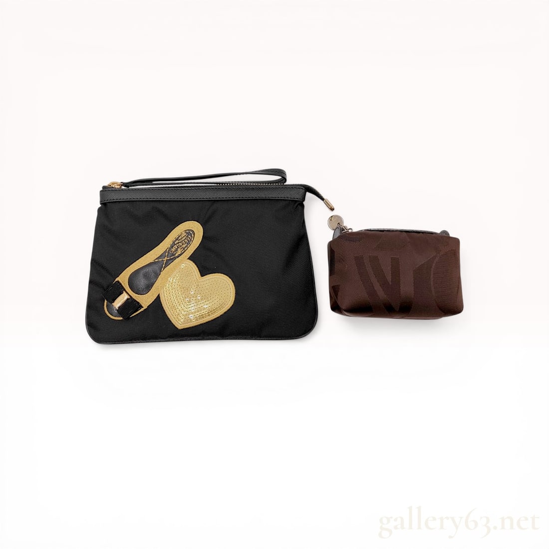 Two Salvatore Ferragamo Nylon Wristlet/Pouches with Box: Two designer pouches featuring a Salvatore Ferragamo black nylon wristlet and a brown logo-patterned fabric accessory pouch. The Ferragamo wristlet is detailed with a sequined heart and Vara shoe appl