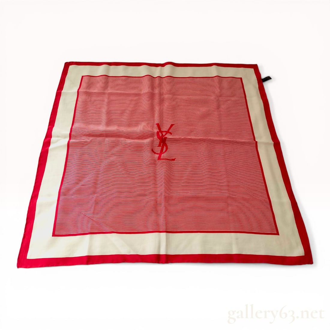 Yves Saint Laurent 1970s Red Striped Logo Silk Square Scarf: Yves Saint Laurent silk foulard, circa 1970s. The square scarf features a central field of thin horizontal red and white stripes with a large integrated YSL monogram, bordered by a wide cream band and