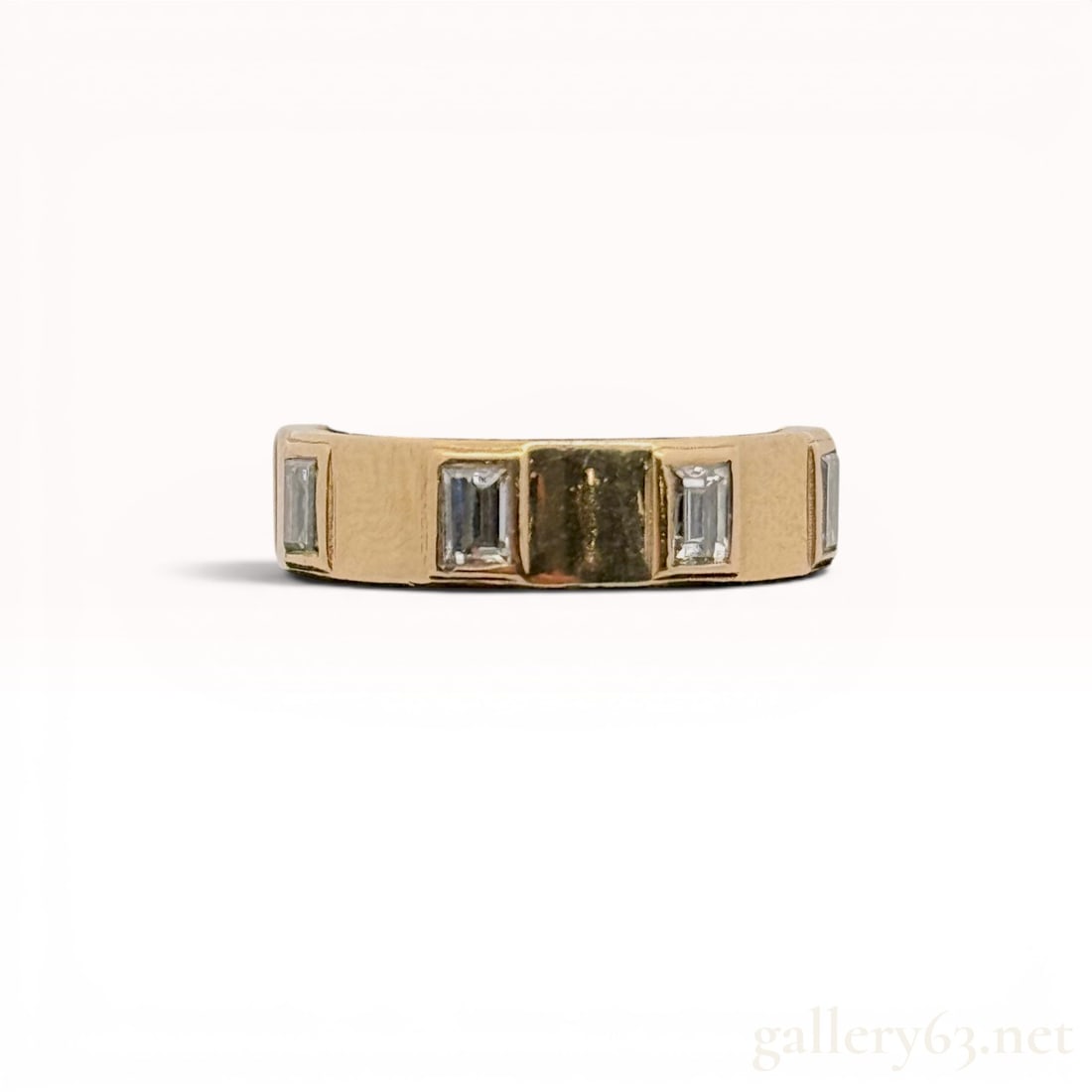14K Yellow Gold and 1.00 Carat Total Weight Lab Grown Diamond Band: Modern 14 karat yellow gold eternity-style band featuring eight lab grown diamonds. Each emerald-cut diamond is flush-set into a recessed rectangular mount spaced evenly around the wide, flat band. Th