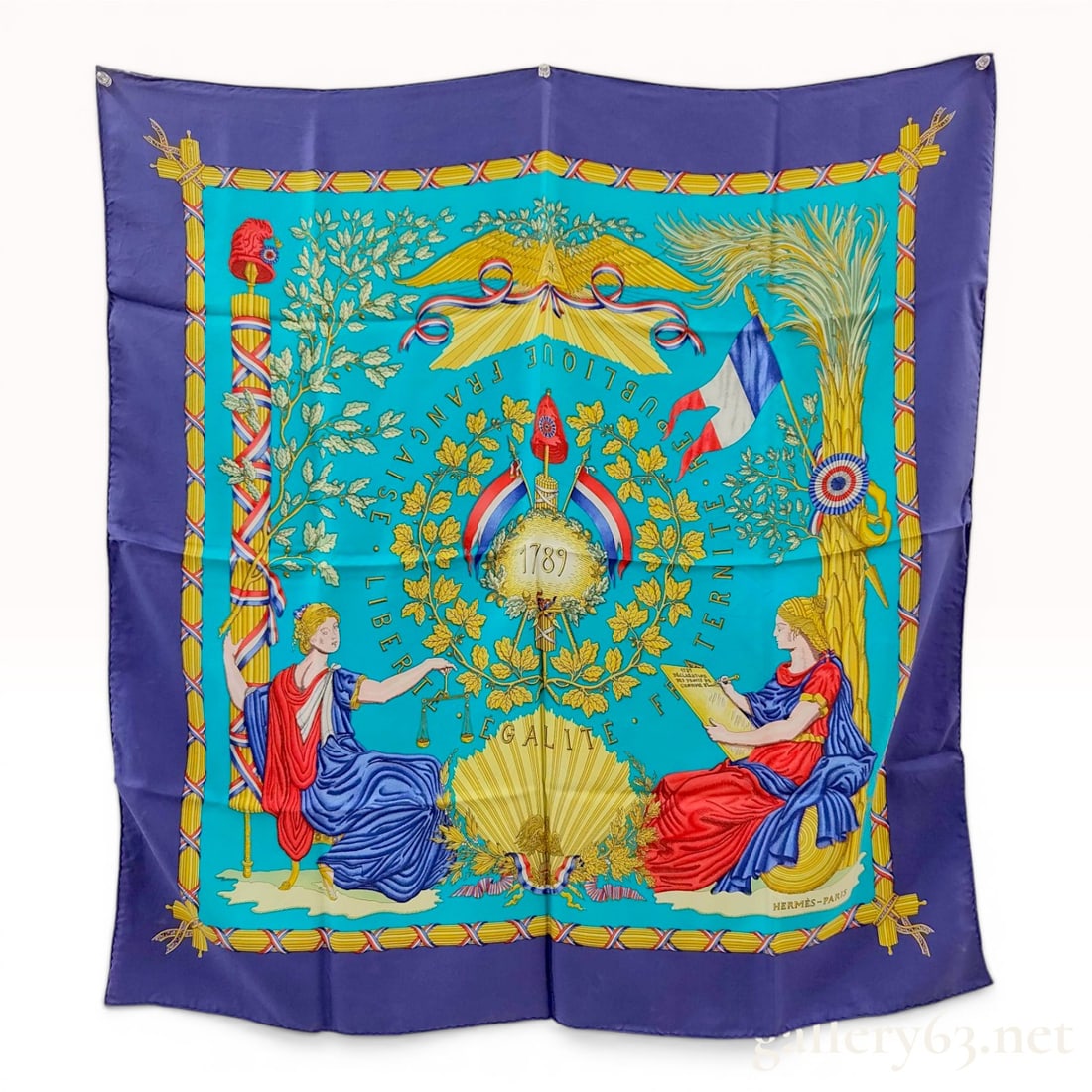 Hermes Republique Francaise Silk Scarf by Joachim Metz: Hermes silk carre scarf in the Republique Francaise pattern, designed by Joachim Metz for the 1989 bicentennial of the French Revolution. The design features a turquoise field and navy blue border wit