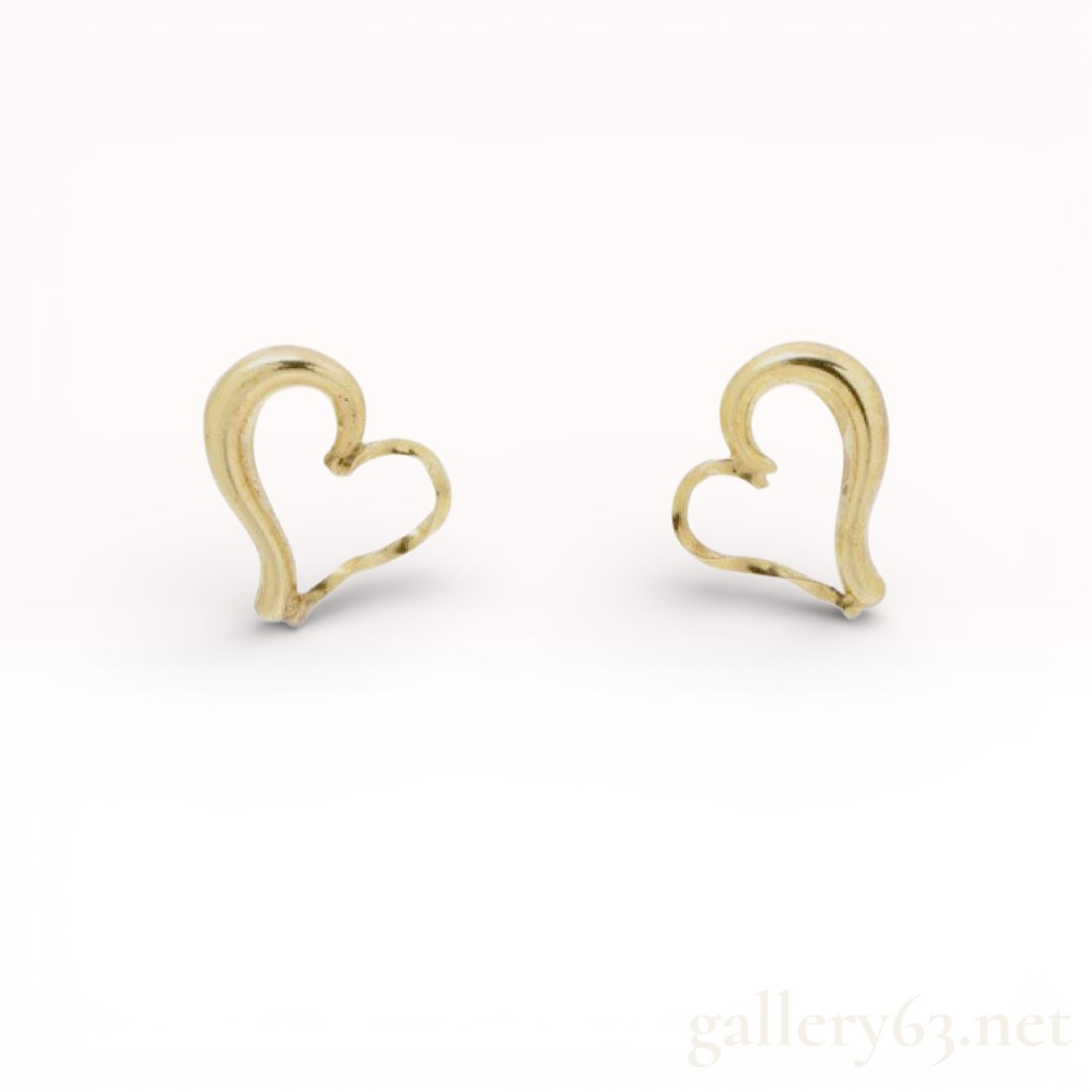 A Pair of 10K Yellow Gold Open Heart Stud Earrings: A pair of contemporary stud earrings featuring a stylized, open-heart design. The earrings are crafted in 10-karat yellow gold with a polished finish. Each earring consists of a contoured, open-form h