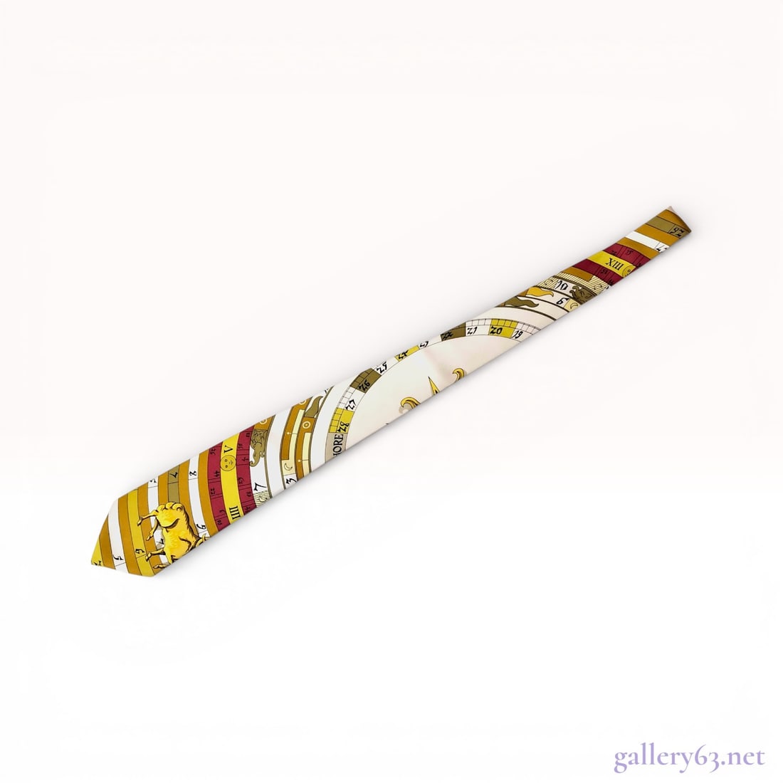 Hermes Silk Necktie, Dies et Hore Pattern: This authentic Hermes Paris necktie is crafted from 100% silk in France. It features the intricate "Dies et Hore" (Days and Hours) motif, a classic astronomical and calendar-themed design. T