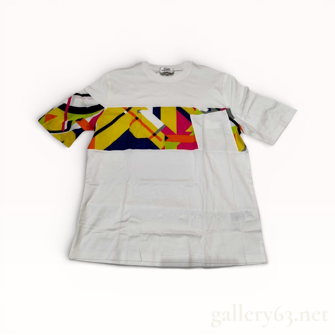 Hermes Poche En Rayure Imprime oversized T-shirt size S: Authentic Herm?¨s short-sleeve cotton T-shirt rendered in white. Front featuring a horizontal printed stripe panel incorporating geometric multicolor motifs across the chest and left sleeve. Design f