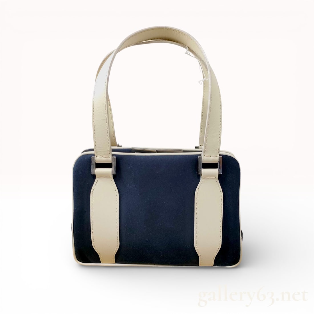 Fendi Vintage Frame Top-Handle Bag, Navy Canvas and Cream Leather: This vintage Fendi handbag features a structured frame design with a navy blue canvas body accented by cream leather trim and dual flat top handles. The silver-tone hardware includes a push-lock clasp