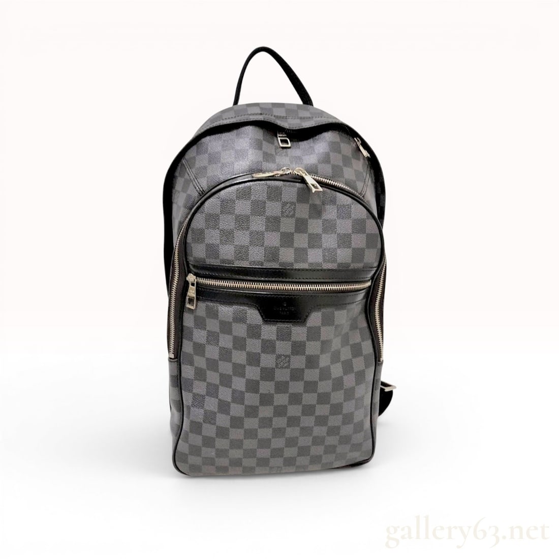 Louis Vuitton Michael Backpack in Damier Graphite Canvas: This Louis Vuitton Michael backpack is crafted from signature Damier Graphite coated canvas, featuring a grey and black checkered pattern. The piece is detailed with black cowhide leather trim and sil