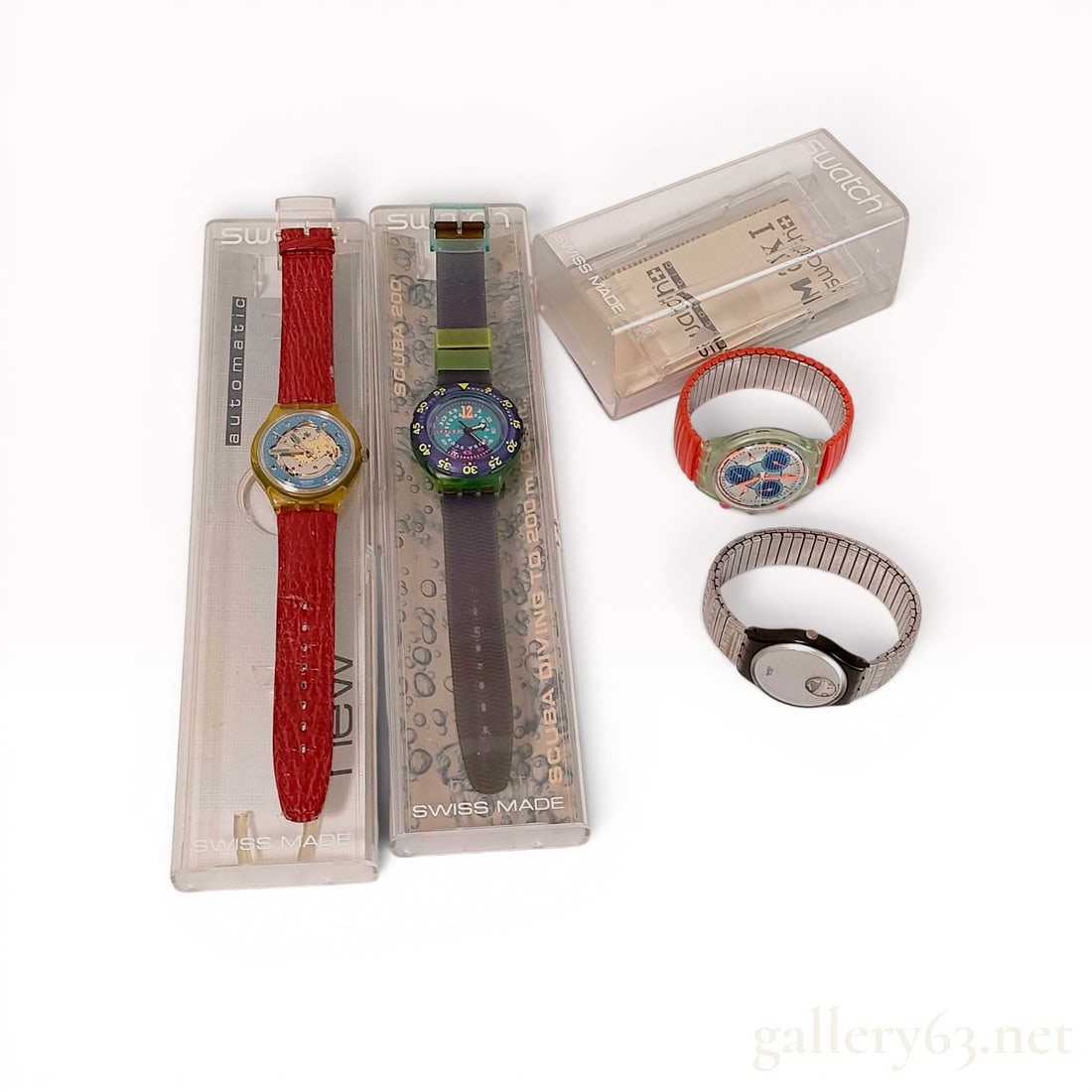 A Collection of Swatch Wristwatches including Automatic, Scuba 200, and Chronograph Models w/Box: A collection of vintage Swatch wristwatches, including an Automatic skeleton dial model, a Scuba 200 with rotating bezel, and a 1993 multi-dial Chronograph. The watches feature various strap styles in