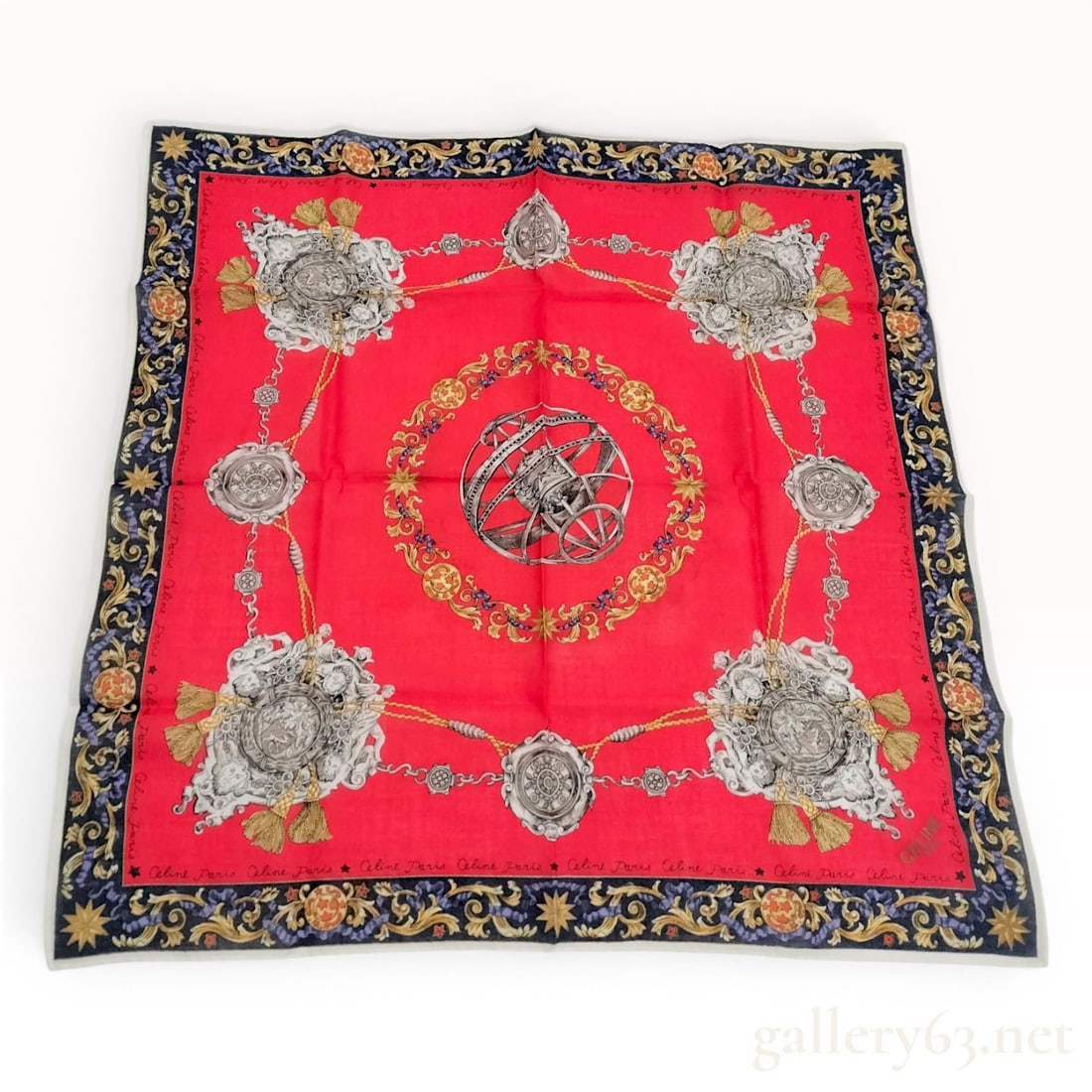 Celine Paris Neoclassical Armillary Sphere Square Silk Scarf: This square silk scarf from Celine Paris features a complex neoclassical design set against a vibrant red central field. At the center of the scarf is a monochromatic armillary sphere, encircled by a 