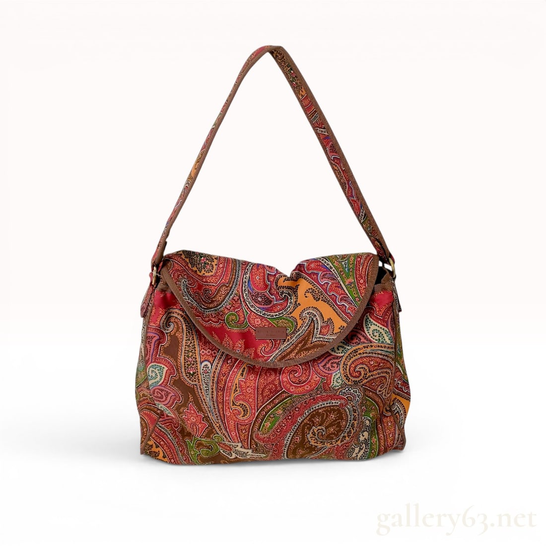Etro Profumi Paisley Print Canvas Flap Shoulder Bag: This shoulder bag from Etro features the brand signature multicolored paisley print in a palette of red, orange, brown, and green. The exterior is constructed from a printed synthetic canvas with tona