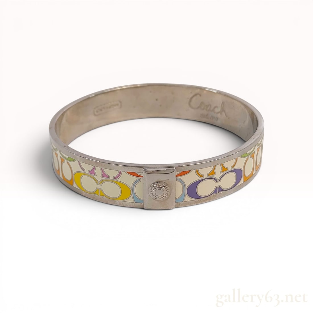 Coach Multi-Color Signature Enamel Hinged Bangle Bracelet w/Box: Coach signature multi-color enamel hinged bangle bracelet. Features the signature C monogram pattern in various colors including yellow, orange, pink, purple, light blue, and green on a cream enamel b