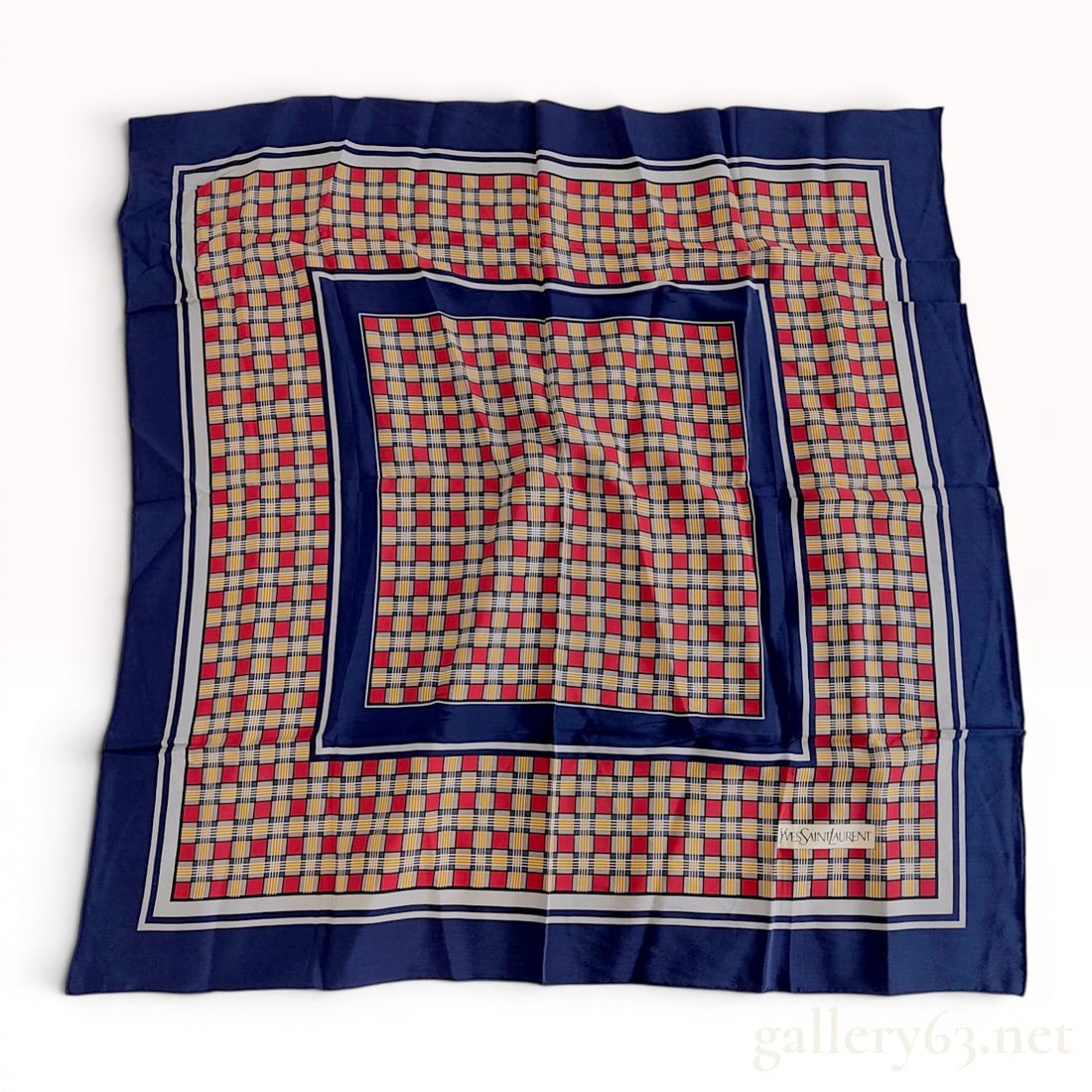 Yves Saint Laurent Silk Square Scarf with Geometric Plaid Pattern w/Box: Vintage Yves Saint Laurent square scarf featuring a multi-tonal geometric plaid design in red, grey, yellow, and navy blue. The 100% silk scarf is finished with hand-rolled hems and contains a printed