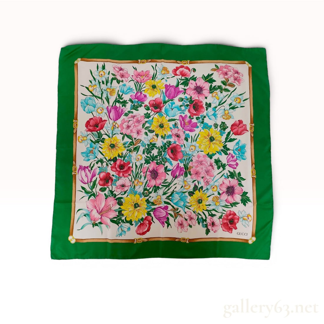 Gucci Silk Flora Print Scarf with Emerald Green Border: Gucci square silk twill scarf featuring the signature Flora botanical print on a cream ground, late 20th century. The central floral bouquet is framed by a printed tan belt border with interlocking G 