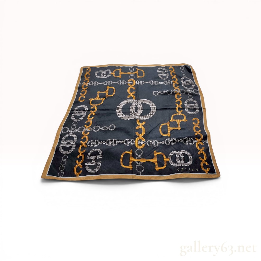 Celine Silk Twill Equestrian Chain Motif Scarf: Celine vintage silk twill square scarf featuring an equestrian-inspired pattern of gold-tone snaffle bits and interlocking chain links. The navy blue ground incorporates circular motifs with repeating