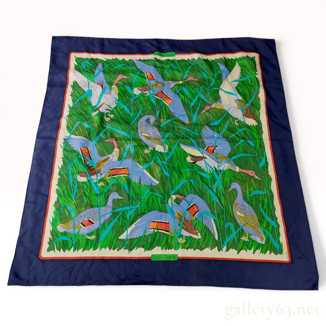 Hermes Cols-Verts Silk Twill Scarf: Hermès silk twill scarf in the Cols-Verts pattern, originally designed by Robert Dallet. The central polychrome scene depicts mallard ducks in a marsh of green and teal reeds, framed by an oran