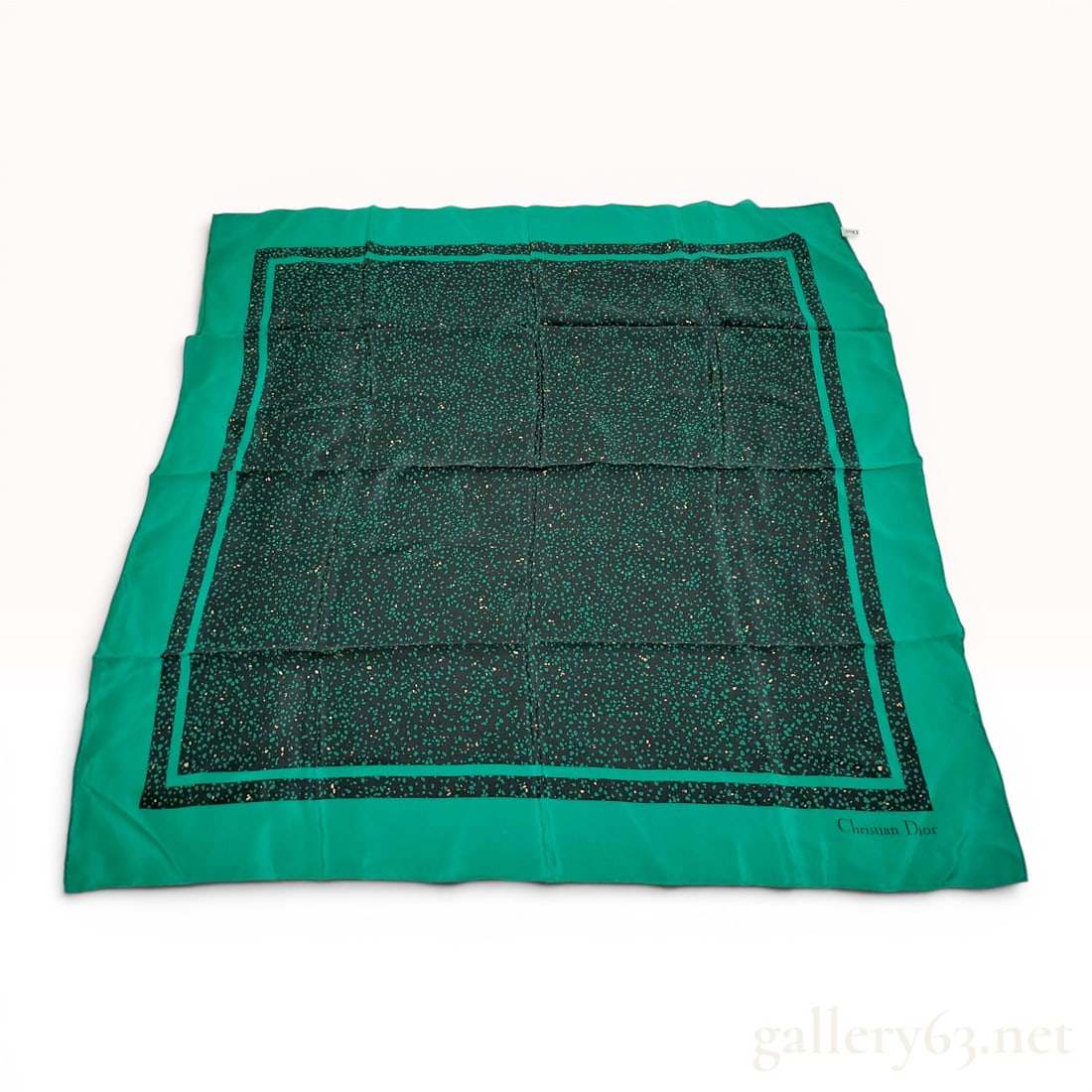 Christian Dior Silk Square Scarf with Emerald Green and Black Terrazzo Pattern: Christian Dior silk square scarf featuring a wide emerald green border and a black central field. The design incorporates an irregular speckled terrazzo or pebble-like pattern in shades of green and g